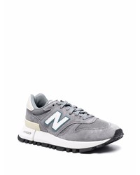 graue Sportschuhe von New Balance