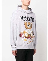 grauer bedruckter Fleece-Pullover mit einem Kapuze von Moschino