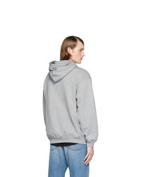 grauer bedruckter Pullover mit einem Kapuze von Balenciaga