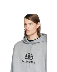 grauer bedruckter Pullover mit einem Kapuze von Balenciaga