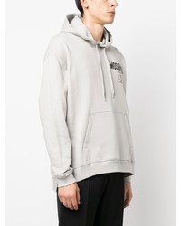 grauer bedruckter Pullover mit einem Kapuze von Moschino