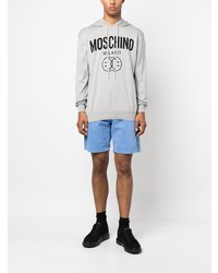 grauer bedruckter Pullover mit einem Kapuze von Moschino