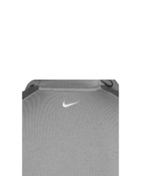 grauer bedruckter Pullover mit einem Kapuze von Nike Sportswear