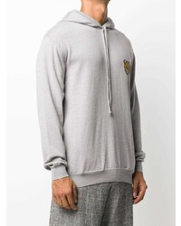 grauer bestickter Pullover mit einem Kapuze von Moschino