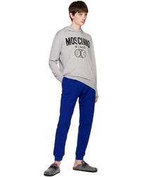 grauer Pullover mit einem Kapuze von Moschino