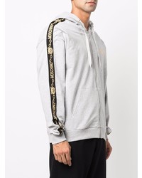 grauer Pullover mit einem Kapuze von Moschino