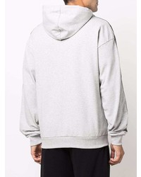 grauer Pullover mit einem Kapuze von Moschino