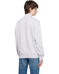 grauer Pullover mit einem Reißverschluss am Kragen von Axel Arigato