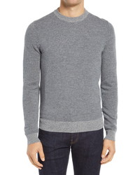 grauer Pullover mit einem Rundhalsausschnitt mit Hahnentritt-Muster