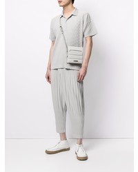 graues Polohemd von Homme Plissé Issey Miyake