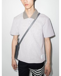 graues Polohemd von Thom Browne