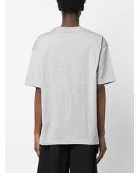 graues T-Shirt mit einem Rundhalsausschnitt mit Flicken von Comme des Garcons Homme