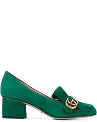 grüne Slipper von Gucci