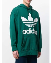 grüner bedruckter Pullover mit einem Kapuze von adidas