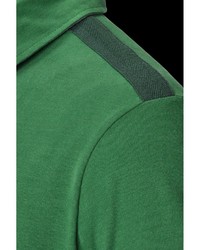 grüner Pullover mit einem zugeknöpften Kragen von Jan Vanderstorm