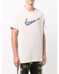 hellbeige bedrucktes T-Shirt mit einem Rundhalsausschnitt von Nike