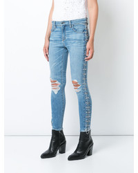 hellblaue enge Jeans aus Baumwolle mit Destroyed-Effekten von Amiri