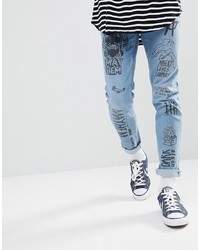 hellblaue bedruckte enge Jeans von ASOS DESIGN