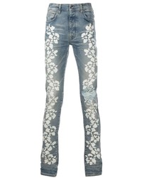 hellblaue enge Jeans mit Blumenmuster