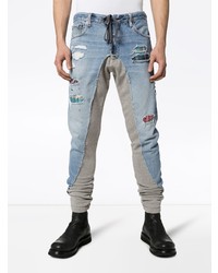 hellblaue enge Jeans mit Destroyed-Effekten von Greg Lauren