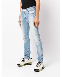 hellblaue enge Jeans mit Destroyed-Effekten von Bossi Sportswear