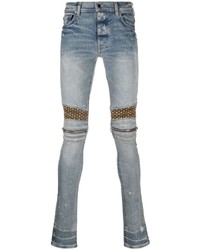 hellblaue enge Jeans mit Destroyed-Effekten von Amiri