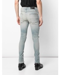 hellblaue enge Jeans mit Destroyed-Effekten von Amiri