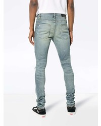 hellblaue enge Jeans mit Destroyed-Effekten von Amiri