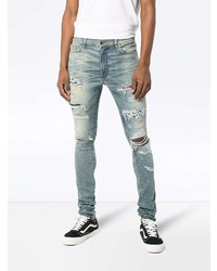 hellblaue enge Jeans mit Destroyed-Effekten von Amiri