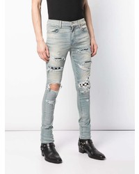 hellblaue enge Jeans mit Destroyed-Effekten von Amiri