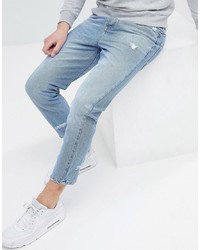 hellblaue enge Jeans mit Destroyed-Effekten von ASOS DESIGN