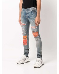 hellblaue enge Jeans mit Destroyed-Effekten von Amiri