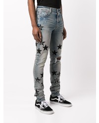 hellblaue enge Jeans mit Destroyed-Effekten von Amiri