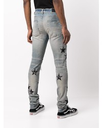 hellblaue enge Jeans mit Destroyed-Effekten von Amiri