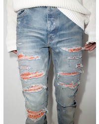 hellblaue enge Jeans mit Destroyed-Effekten von Amiri