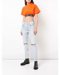 hellblaue enge Jeans mit Destroyed-Effekten von Heron Preston