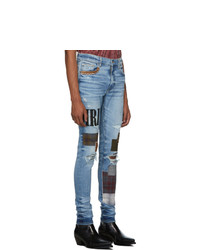 hellblaue enge Jeans mit Destroyed-Effekten von Amiri