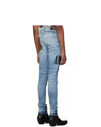 hellblaue enge Jeans mit Destroyed-Effekten von Amiri