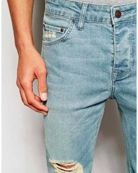 hellblaue enge Jeans mit Destroyed-Effekten von Asos