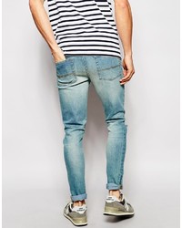 hellblaue enge Jeans mit Destroyed-Effekten von Asos