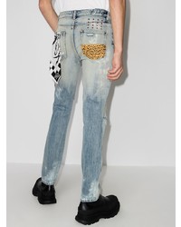 hellblaue enge Jeans mit Destroyed-Effekten von Ksubi