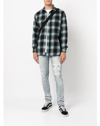 hellblaue enge Jeans mit Destroyed-Effekten von Ksubi