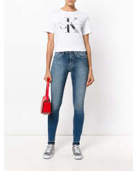 hellblaue enge Jeans mit Destroyed-Effekten von CK Calvin Klein