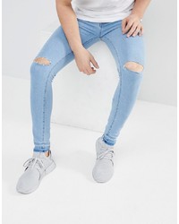 hellblaue enge Jeans mit Destroyed-Effekten von Criminal Damage