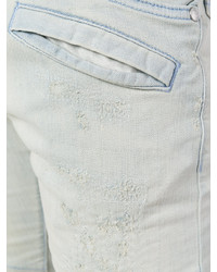 hellblaue enge Jeans mit Destroyed-Effekten von Pierre Balmain