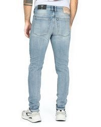 hellblaue enge Jeans mit Destroyed-Effekten von Diesel