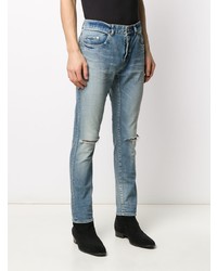 hellblaue enge Jeans mit Destroyed-Effekten von Saint Laurent