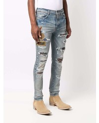 hellblaue enge Jeans mit Destroyed-Effekten von Amiri