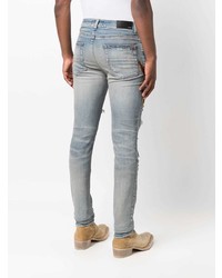 hellblaue enge Jeans mit Destroyed-Effekten von Amiri