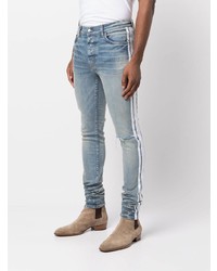 hellblaue enge Jeans mit Destroyed-Effekten von Amiri